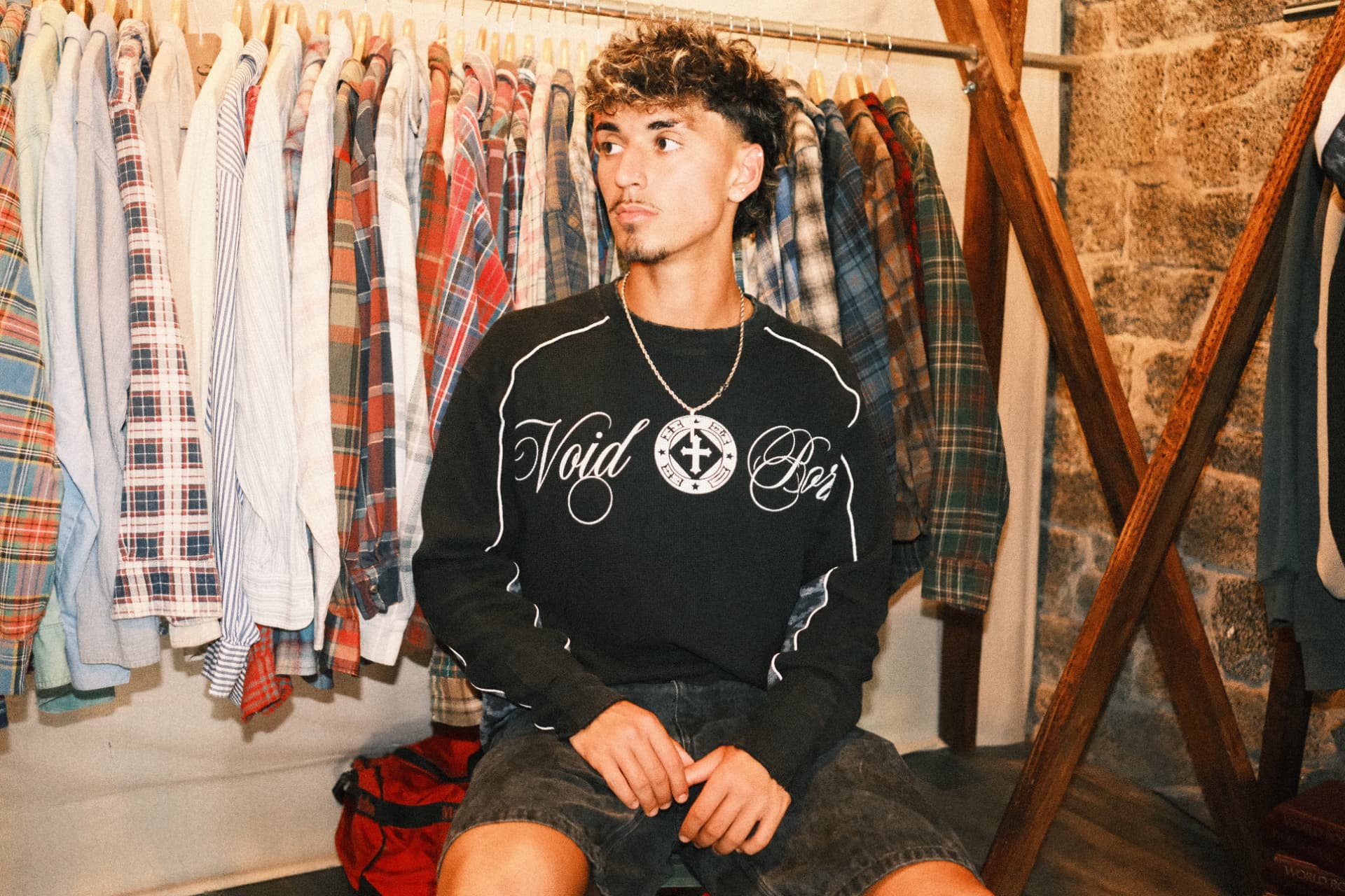 Voidborn black thermal worn in a vintage clothing shop